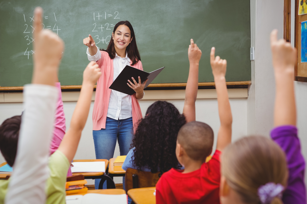 Teacher,Reading,Her,Pupils,A,Story,At,The,Elementary,School