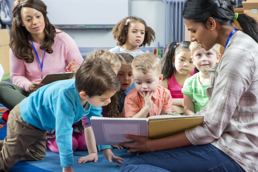 Teacher guiding students in the classroom