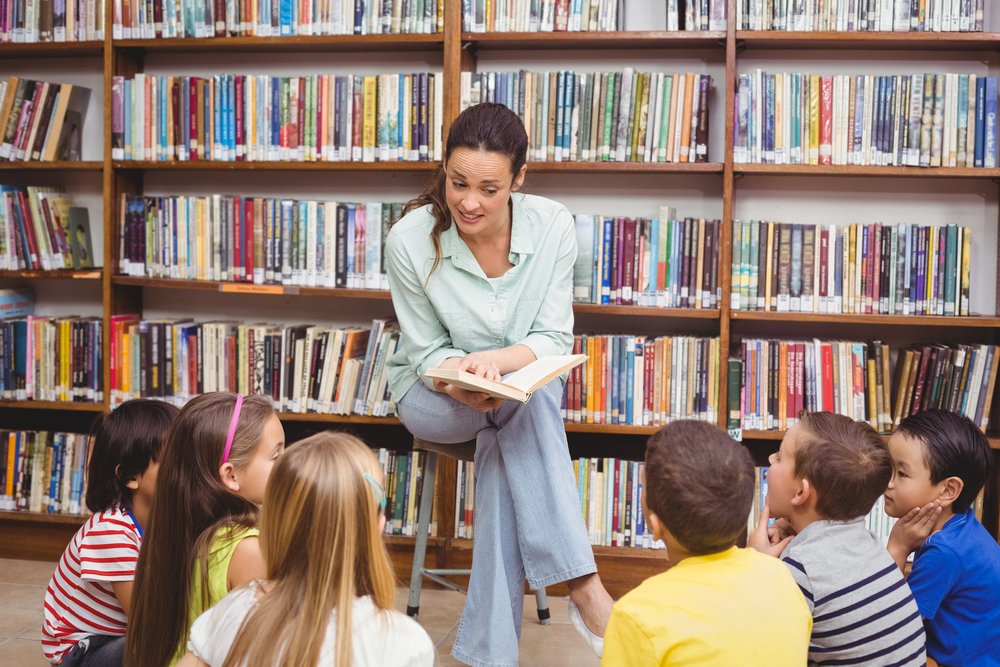 Teacher guiding students in the classroom