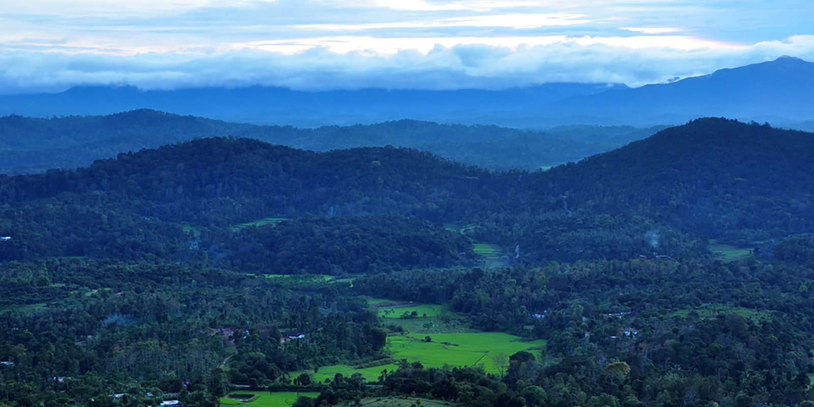 Beautiful monsoon landscape in India with lush green hills and waterfalls